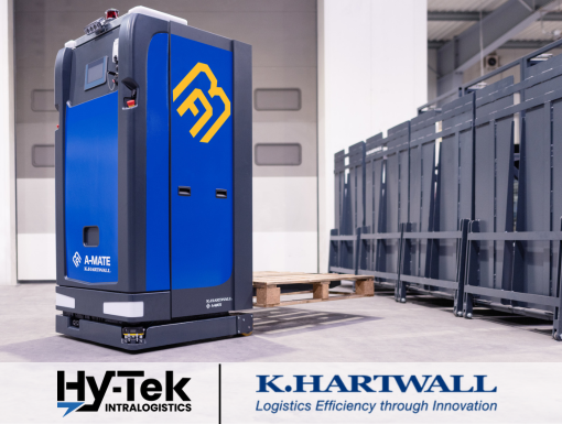 Blue robotic fork lift carrying pallet in warehouse